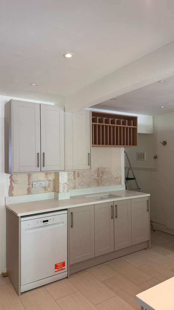 Hand-crafted solid oak plate rack cabinet and bespoke joinery run