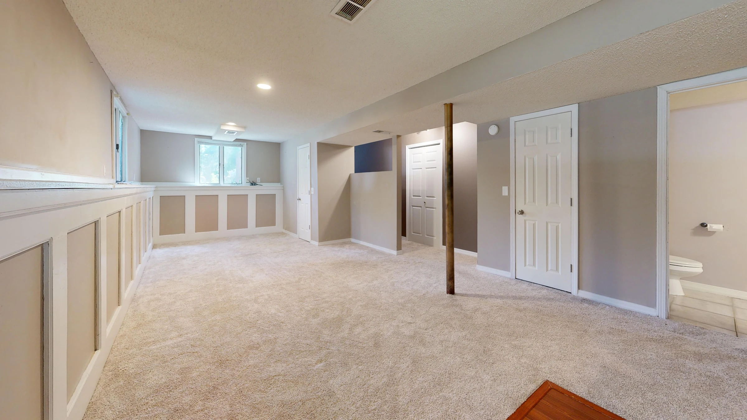 Finished basement with recessed lighting and additional living space