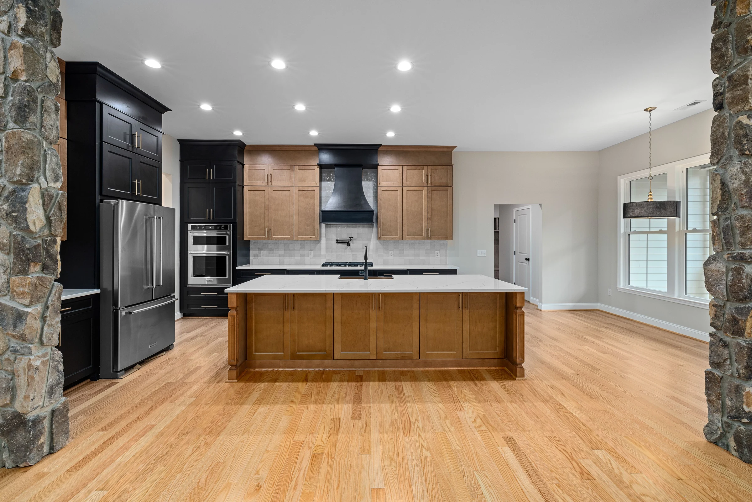 Spacious fitted kitchen with timber island and tailored cabinetry
