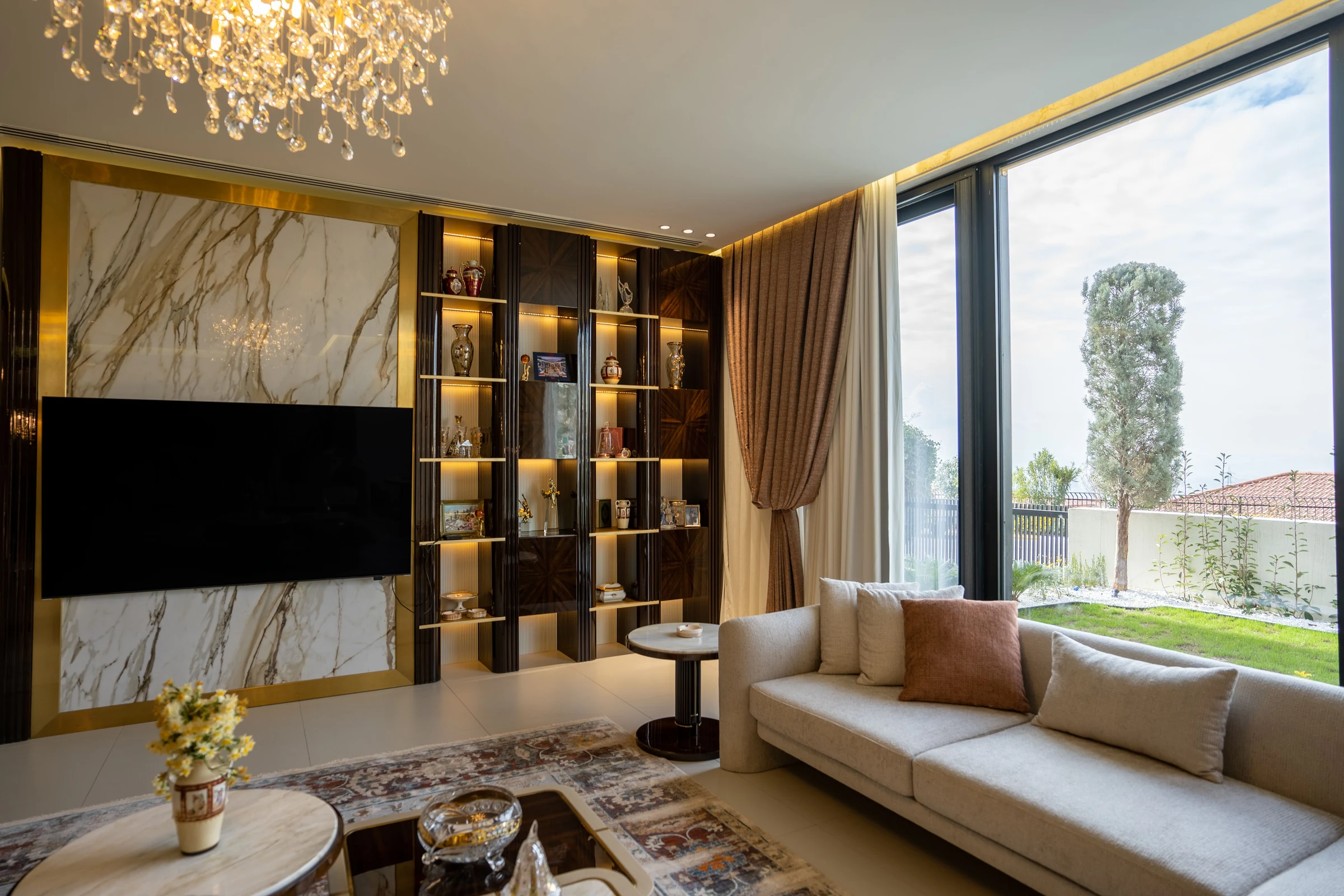 Contemporary living room with coordinated lighting, furnishings and finishes